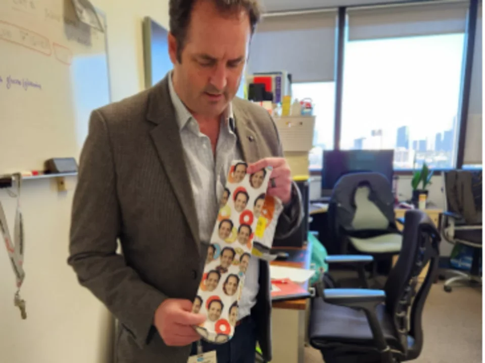 Member(s) of the Robert Prins Lab holding a tie